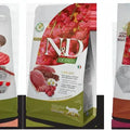 N&D Quinoa Urinary cat food bag featuring duck, cranberry, and chamomile imagery on a white and olive green package.