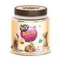 A jar of Lolo Pets Classic Bakery Product dog treats, featuring a clear plastic container with a brown lid and a beige label showing a small dog and chocolate-shaped treats.
